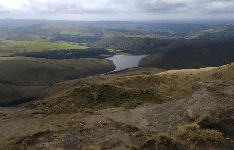 Descending the Pennine Way with Kinder Reservoir in the background.